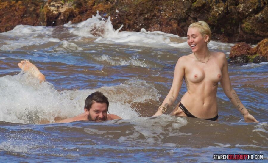 Free porn pics of  Miley Cyrus Topless Bikini Candids In Hawaii 17 of 25 pics