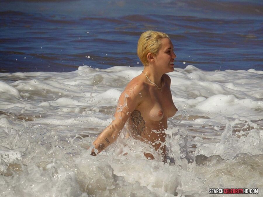 Free porn pics of  Miley Cyrus Topless Bikini Candids In Hawaii 19 of 25 pics