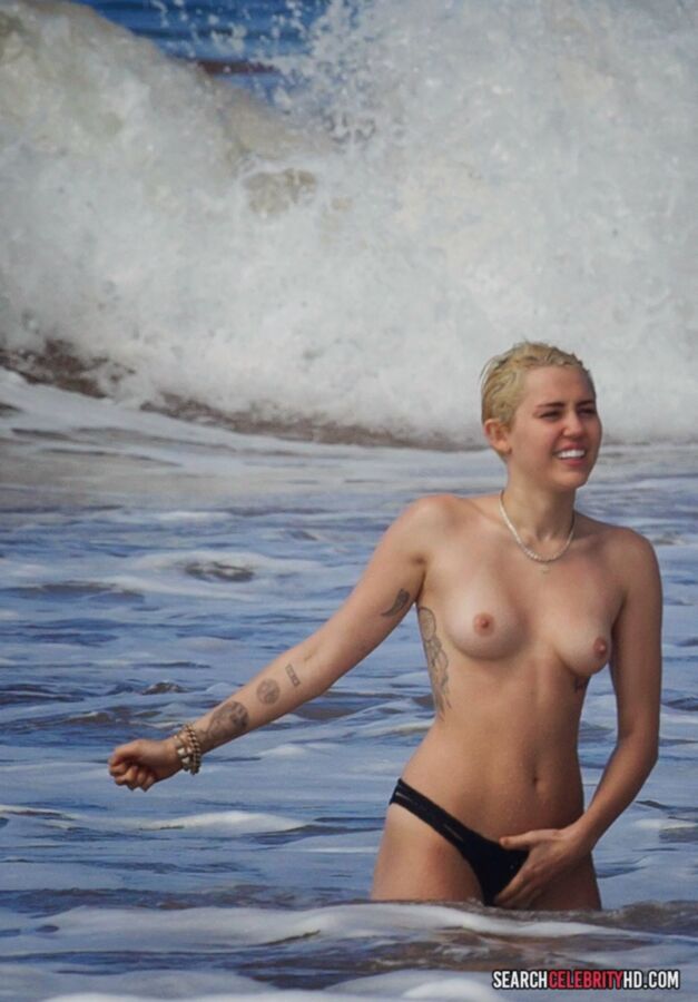 Free porn pics of  Miley Cyrus Topless Bikini Candids In Hawaii 12 of 25 pics