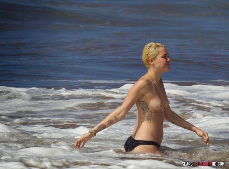 Free porn pics of  Miley Cyrus Topless Bikini Candids In Hawaii 20 of 25 pics