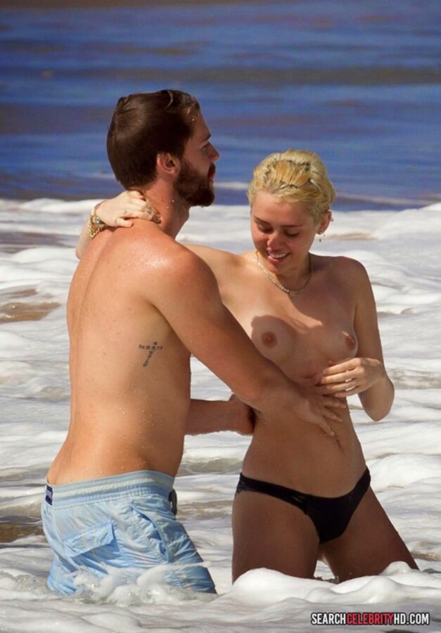 Free porn pics of  Miley Cyrus Topless Bikini Candids In Hawaii 3 of 25 pics