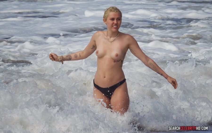 Free porn pics of  Miley Cyrus Topless Bikini Candids In Hawaii 21 of 25 pics