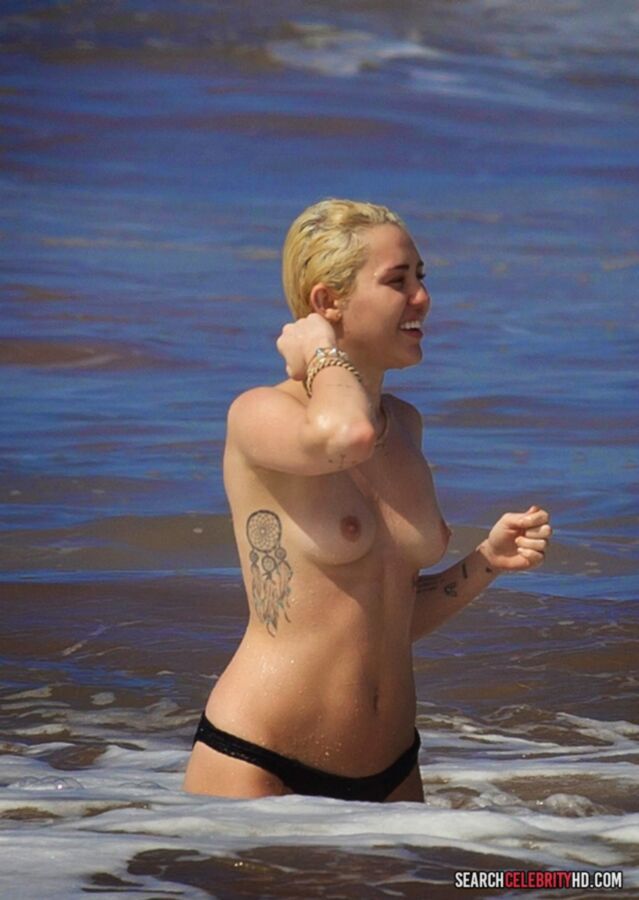 Free porn pics of  Miley Cyrus Topless Bikini Candids In Hawaii 15 of 25 pics