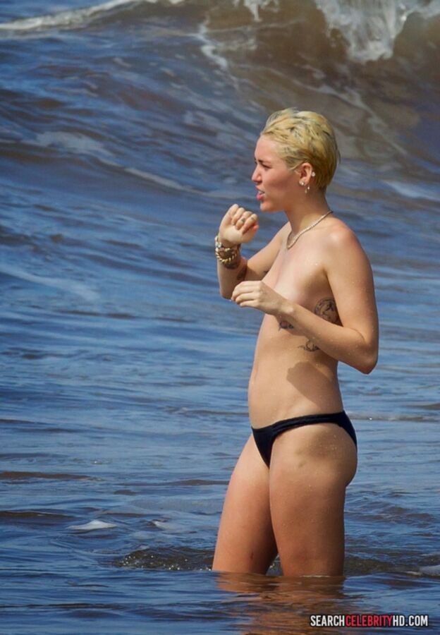 Free porn pics of  Miley Cyrus Topless Bikini Candids In Hawaii 6 of 25 pics