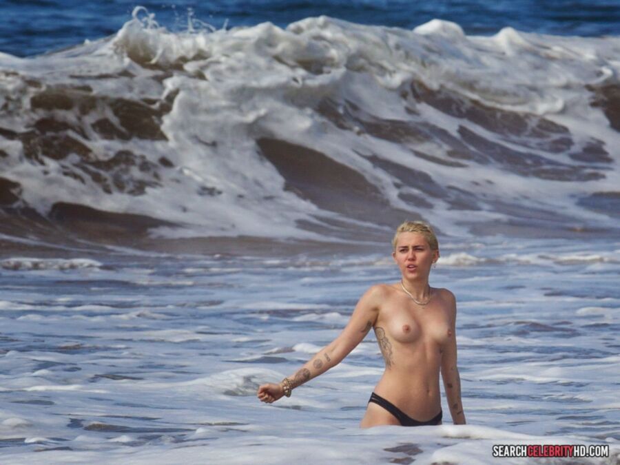Free porn pics of  Miley Cyrus Topless Bikini Candids In Hawaii 24 of 25 pics