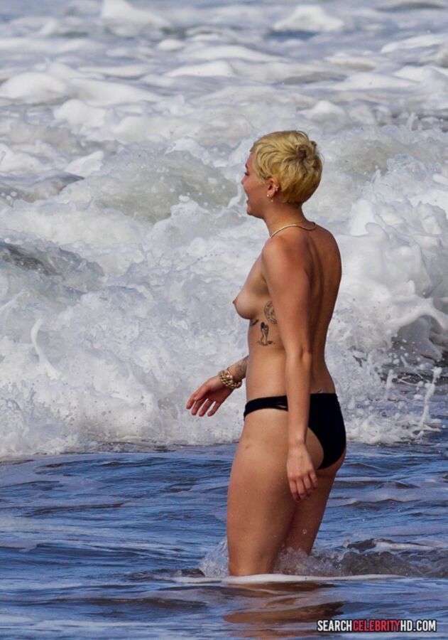 Free porn pics of  Miley Cyrus Topless Bikini Candids In Hawaii 11 of 25 pics