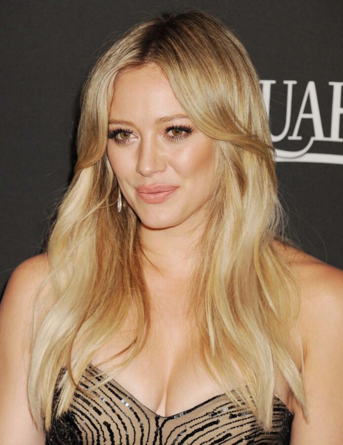 Free porn pics of  Hilary Duff shows off boobies in dress 4 of 16 pics