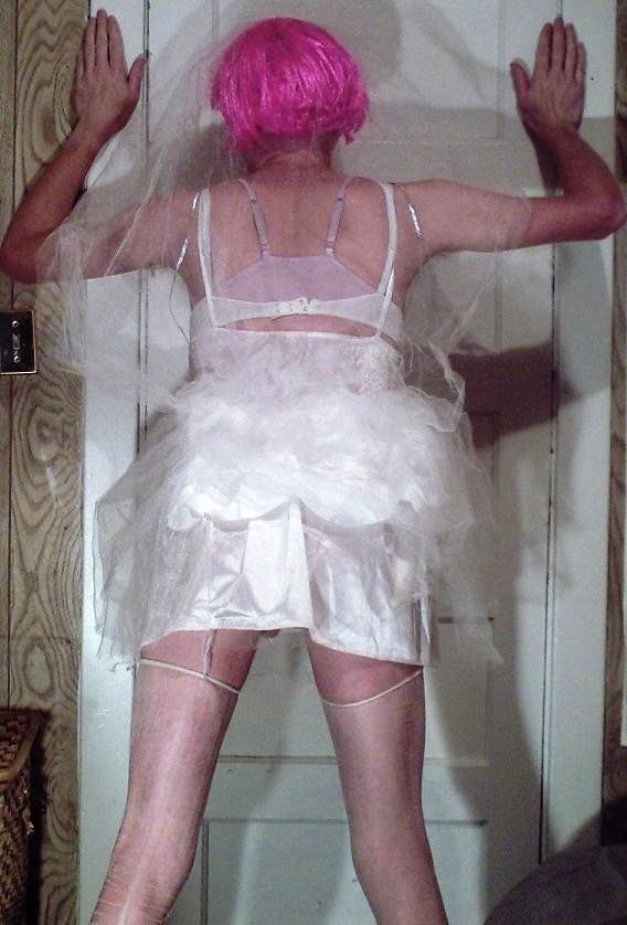 Free porn pics of Crossdresser in various outfits, including wedding dress 12 of 26 pics