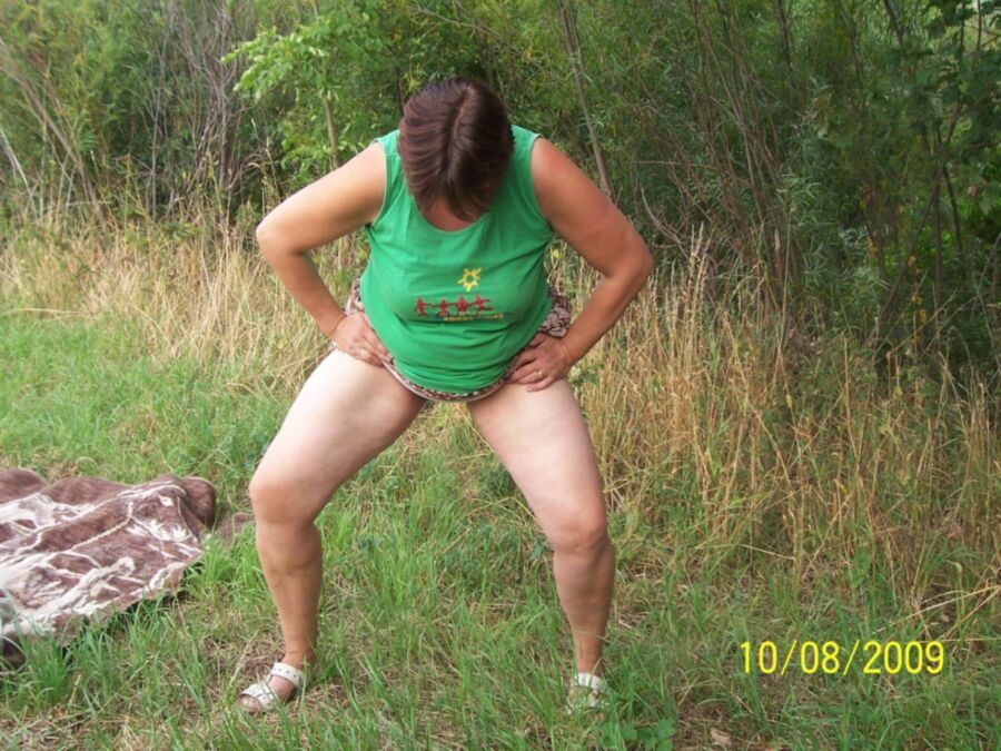 Free porn pics of Fat pissing mature whore in nature 14 of 16 pics