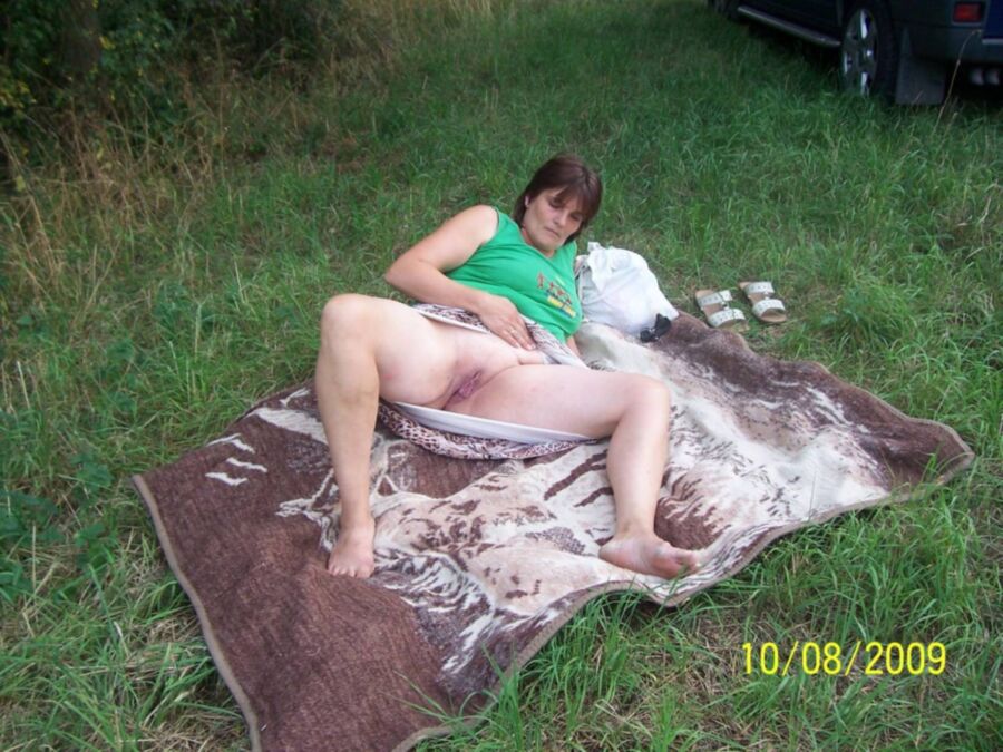 Free porn pics of Fat pissing mature whore in nature 6 of 16 pics