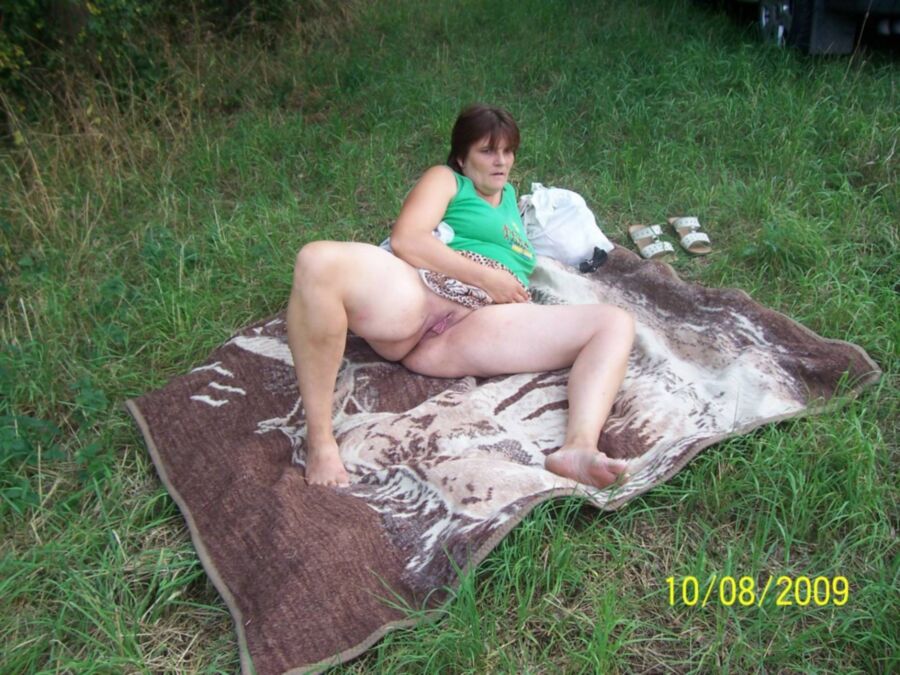 Free porn pics of Fat pissing mature whore in nature 10 of 16 pics