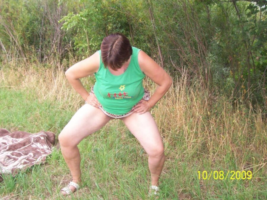 Free porn pics of Fat pissing mature whore in nature 11 of 16 pics