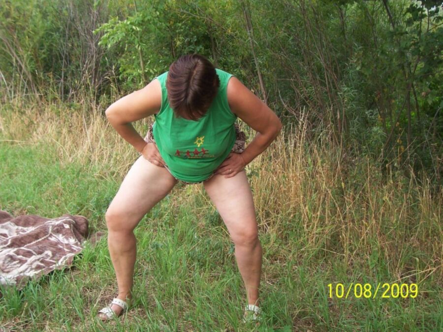 Free porn pics of Fat pissing mature whore in nature 13 of 16 pics