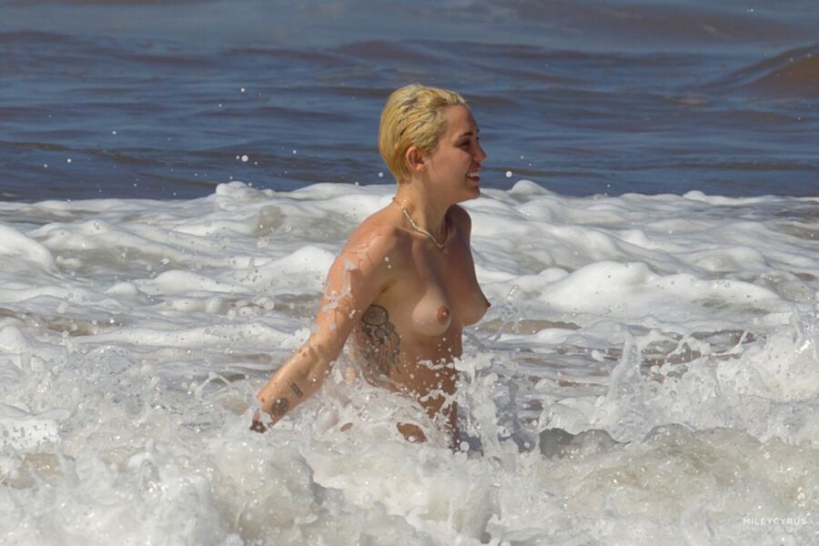 Free porn pics of Miley Cyrus Topless In Maui 1 of 37 pics