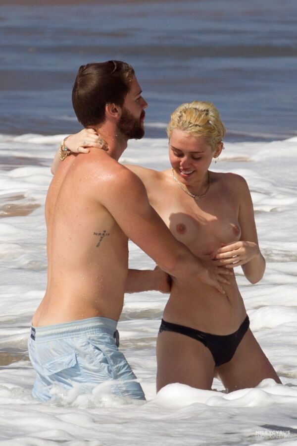 Free porn pics of Miley Cyrus Topless In Maui 2 of 37 pics