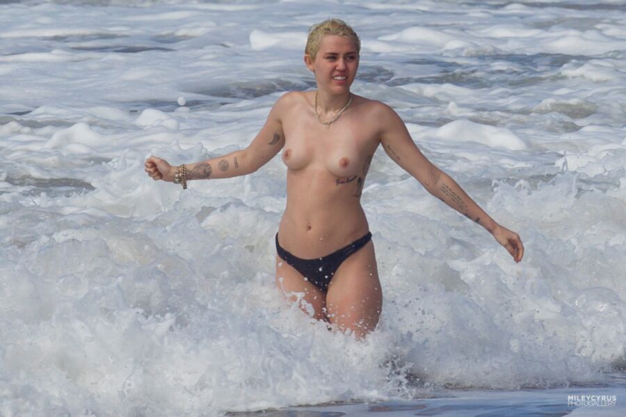 Free porn pics of Miley Cyrus Topless In Maui 6 of 37 pics