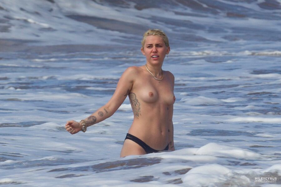 Free porn pics of Miley Cyrus Topless In Maui 3 of 37 pics