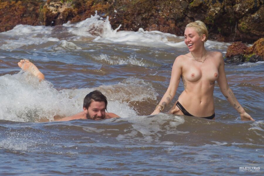 Free porn pics of Miley Cyrus Topless In Maui 14 of 37 pics
