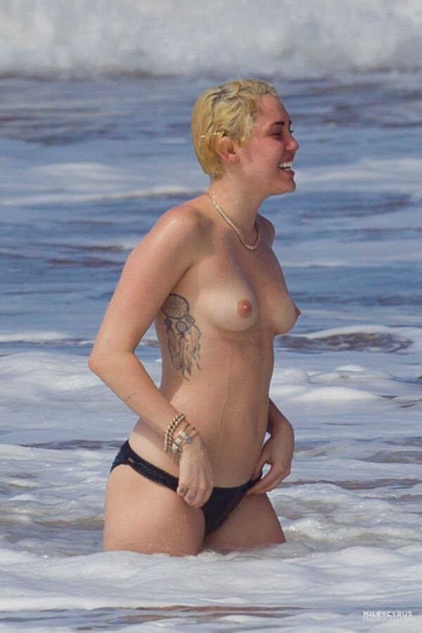 Free porn pics of Miley Cyrus Topless In Maui 13 of 37 pics