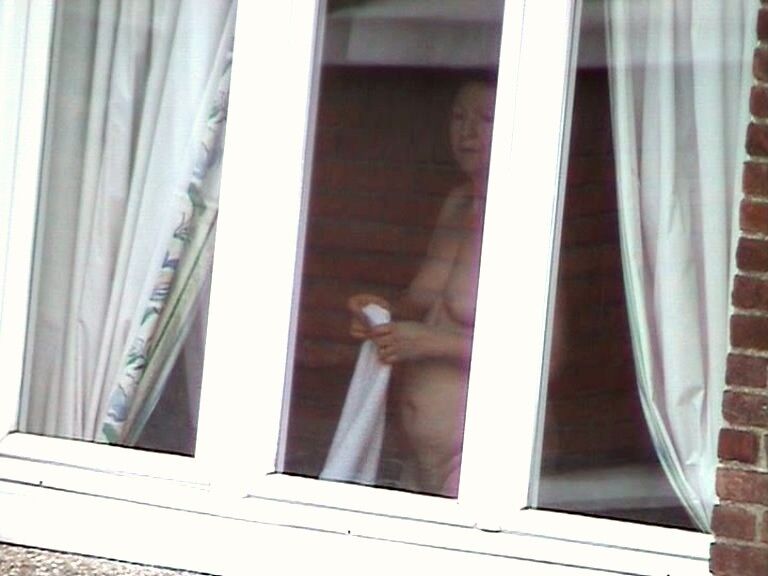 Free porn pics of Voyeur : My old Neighboor naked at the window ! 14 of 25 pics