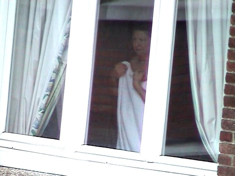 Free porn pics of Voyeur : My old Neighboor naked at the window ! 15 of 25 pics