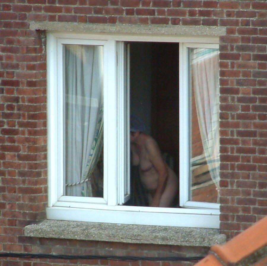 Free porn pics of Voyeur : My old Neighboor naked at the window ! 7 of 25 pics