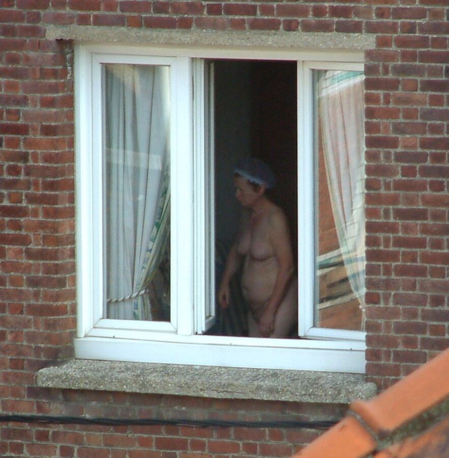 Free porn pics of Voyeur : My old Neighboor naked at the window ! 3 of 25 pics