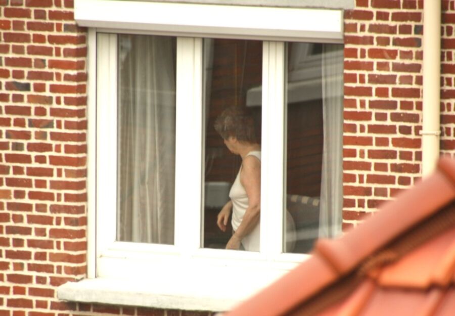 Free porn pics of Voyeur : My old Neighboor naked at the window ! 24 of 25 pics