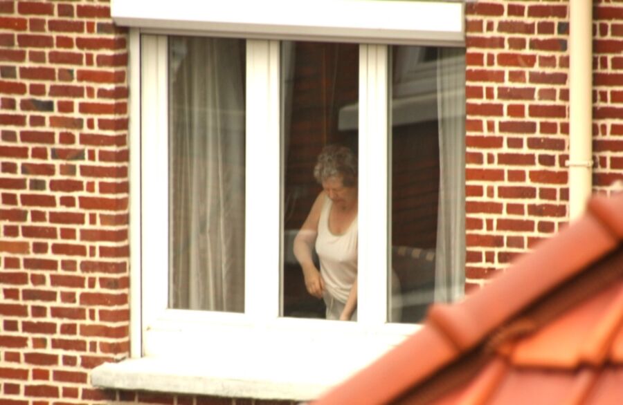 Free porn pics of Voyeur : My old Neighboor naked at the window ! 23 of 25 pics