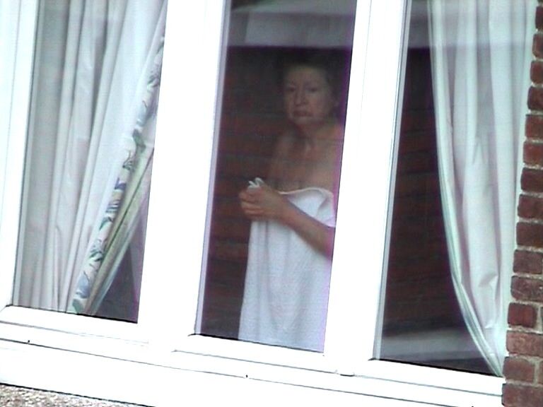 Free porn pics of Voyeur : My old Neighboor naked at the window ! 16 of 25 pics