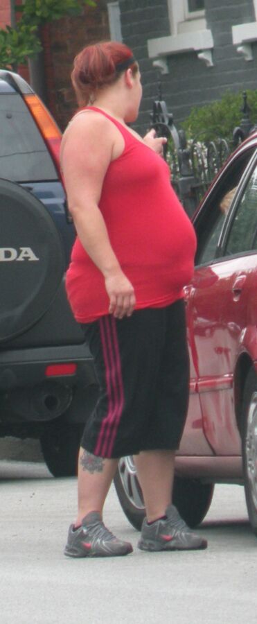 Free porn pics of Very Big Belly Hottie in Tight Red Top THICK and ROUND 5 of 7 pics