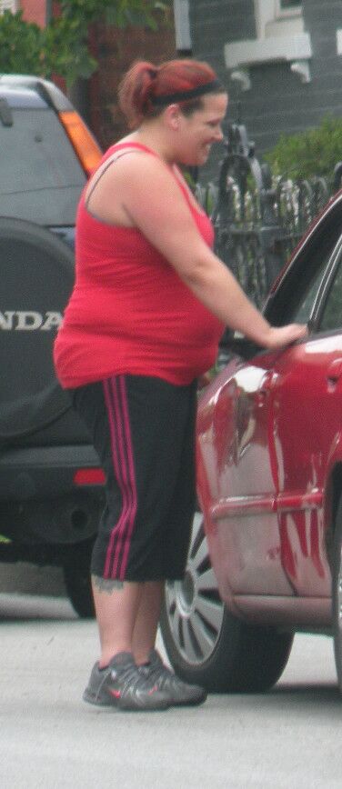 Free porn pics of Very Big Belly Hottie in Tight Red Top THICK and ROUND 7 of 7 pics
