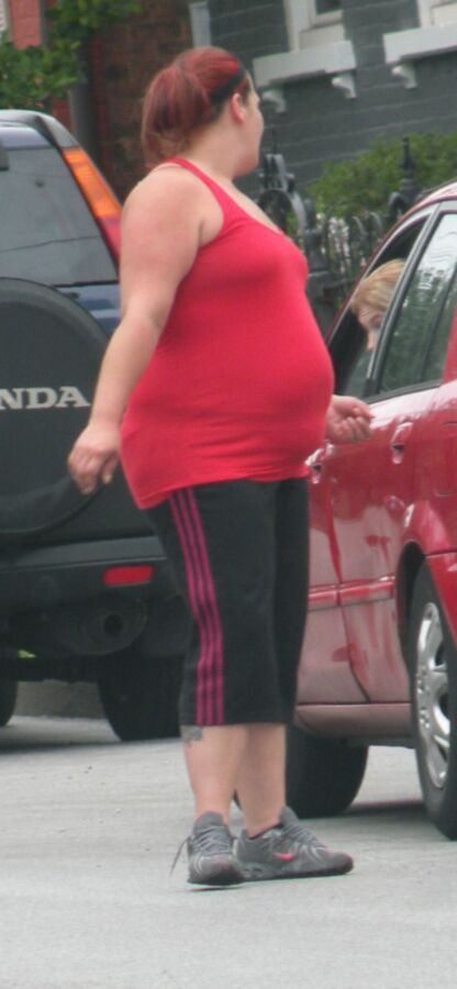Free porn pics of Very Big Belly Hottie in Tight Red Top THICK and ROUND 3 of 7 pics