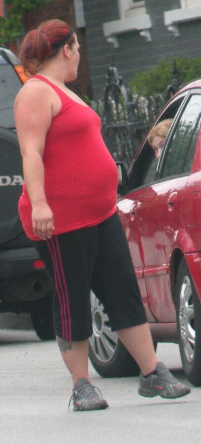 Free porn pics of Very Big Belly Hottie in Tight Red Top THICK and ROUND 1 of 7 pics