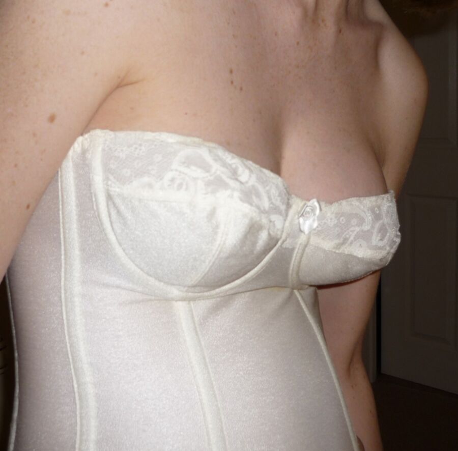 Free porn pics of Sexy cleavage in a white CORSET 8 of 20 pics