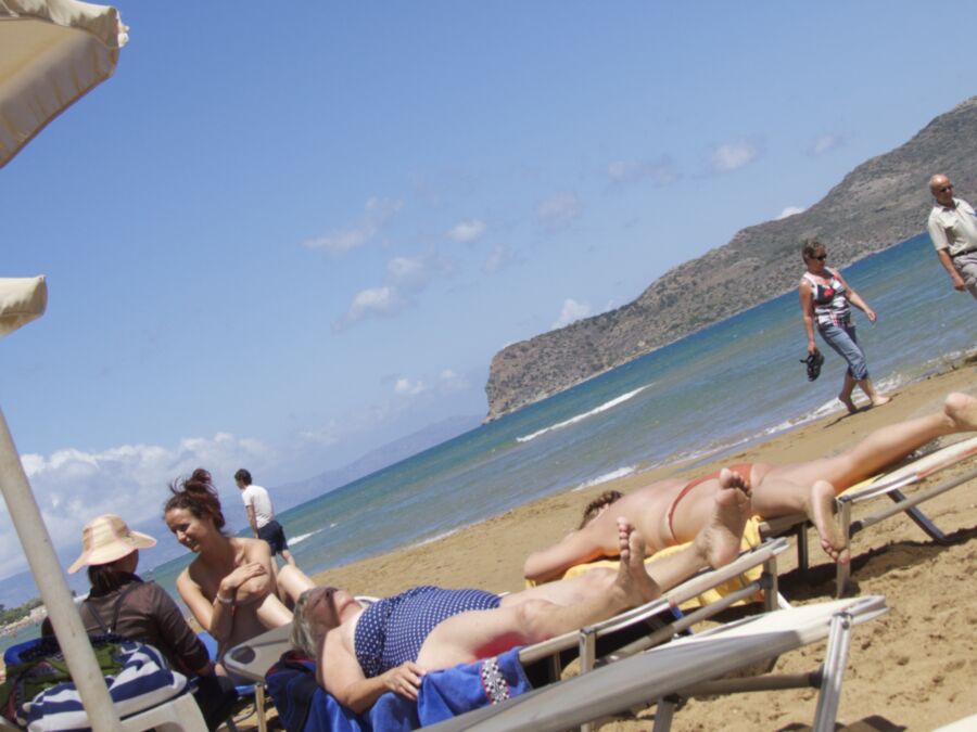 Free porn pics of Girl with a bun caught topless in Agia Marina, Creta. 11 of 18 pics