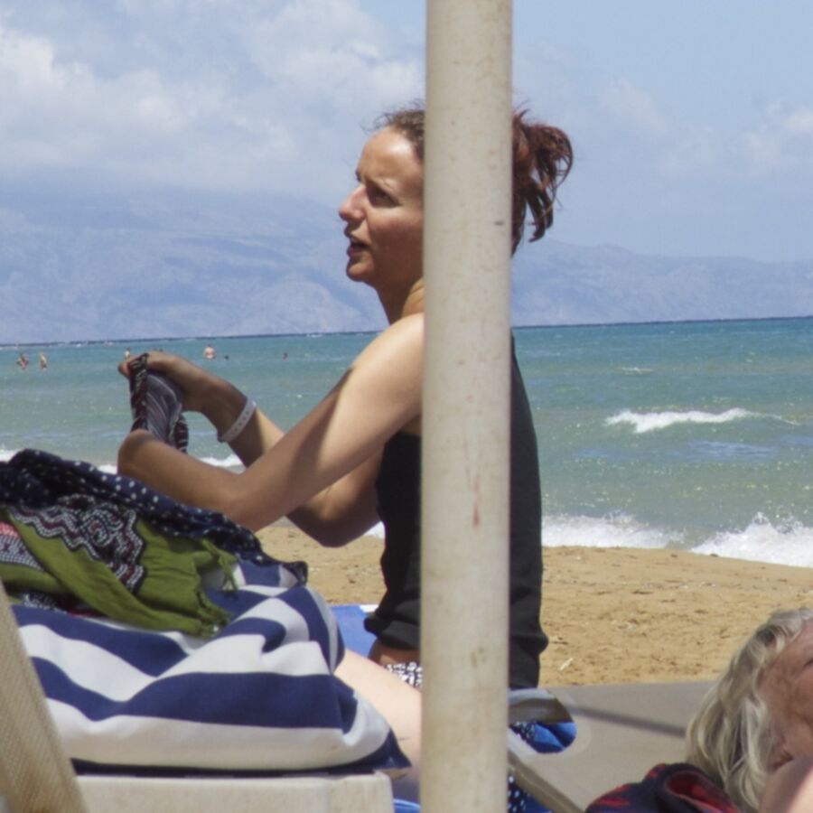 Free porn pics of Girl with a bun caught topless in Agia Marina, Creta. 18 of 18 pics