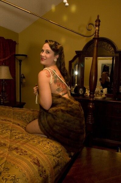 Free porn pics of Tattooed woman in furs does boudoir shoot at home 17 of 47 pics