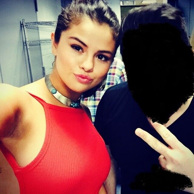 Free porn pics of Selena Gomez Beautiful breast in a red blouse 3 of 28 pics