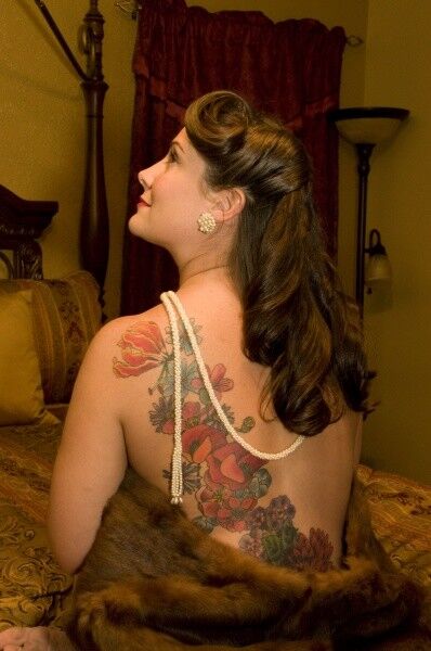 Free porn pics of Tattooed woman in furs does boudoir shoot at home 18 of 47 pics